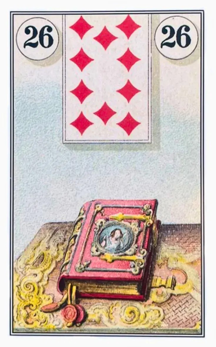 Um livro grande de capa dura vermelha em cima de uma mesa