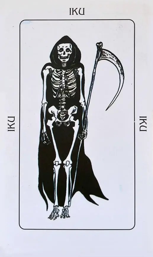 uma caveira com uma capa preta e segurando na m�o uma foice da morte