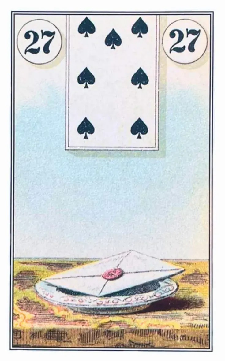 uma carta branca com um selo vermelho em cima de uma mesa