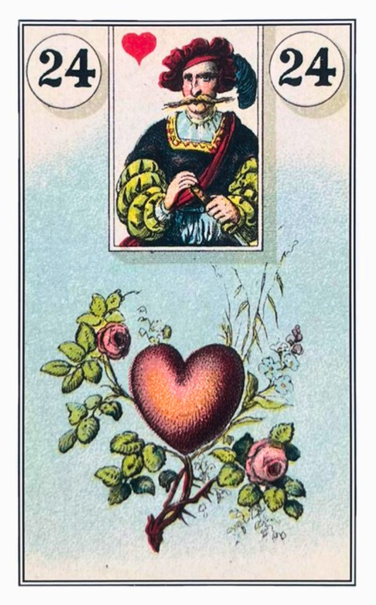 Um cora��o vermelho e um galho de arvore cheio de flores.