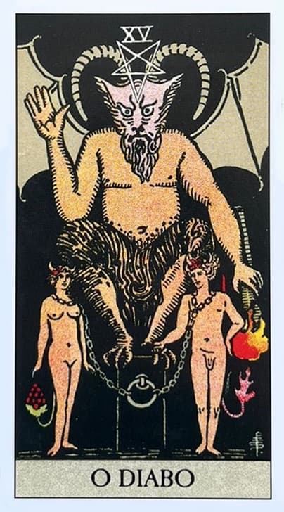 a figura do diabo ou a besta com seus chifres e sua asa grande, ele esta sentado em um pedestal e sob seus pes, duas figuras humanas, um homem e uma mulher que est�o acorrentados e pelados.