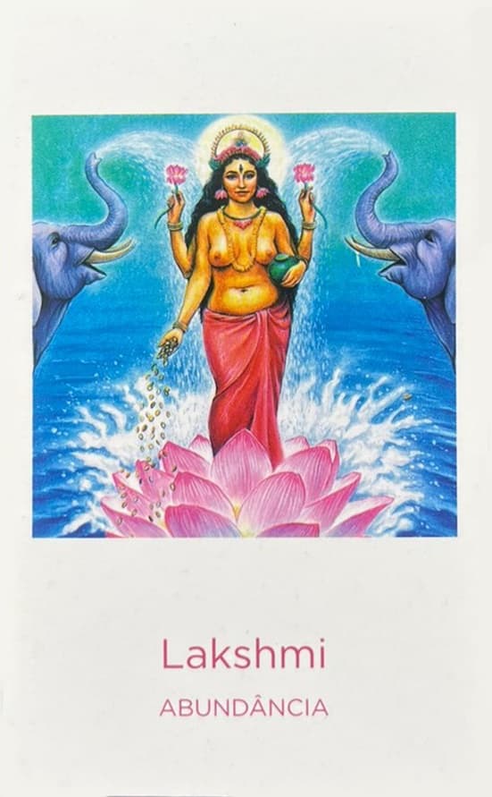 a deusa lakshmi em cima de uma flor de lotus com um elefante de cada lado soltando agua pela tromba.