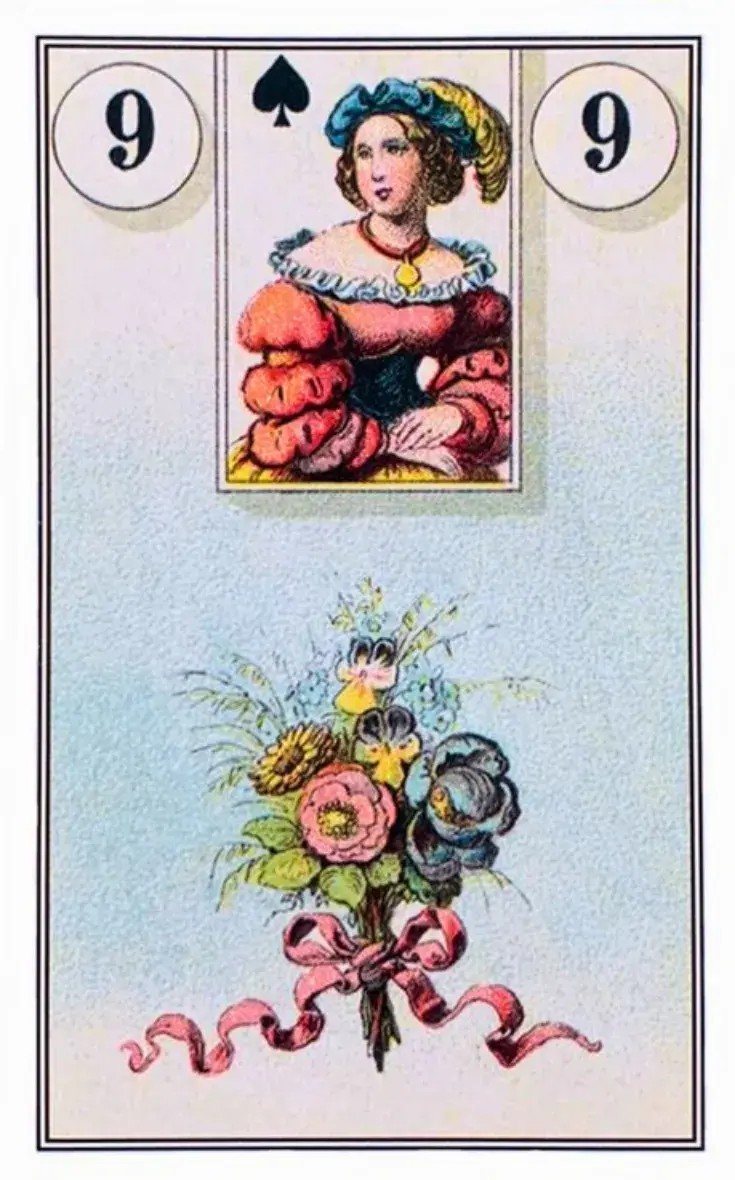 No centro da imagem, vemos um buqu� de flores coloridas e vibrantes amarradas por uma fita rosa.