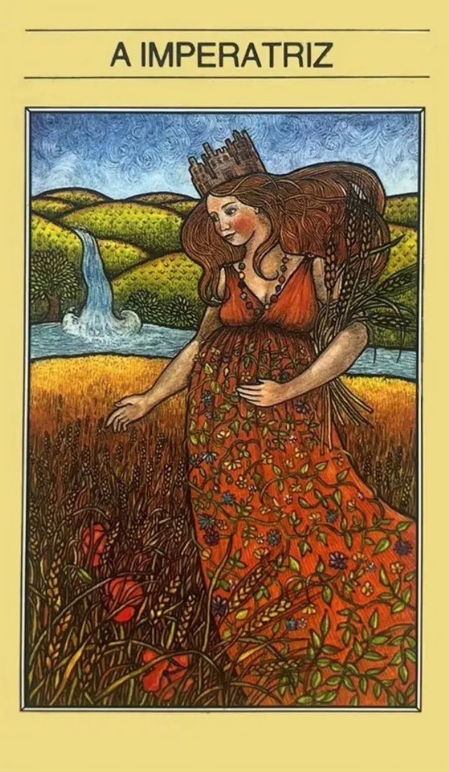 uma mulher com um vestido lindo em um campo com uma cachoeira ao fundo e um lindo campo verde.