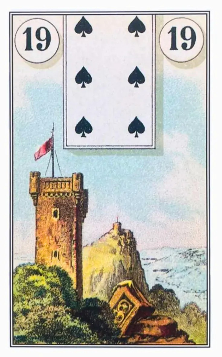 uma torre de um castelo com uma bandeira em um mastro em cima.